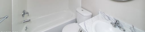 Renovated bathroom with granite countertop