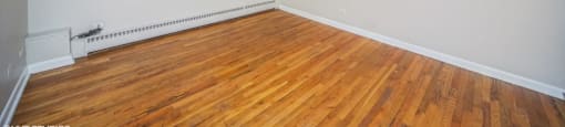 Large windows and rich hardwood flooring at 1355 Pearl in Denver, CO