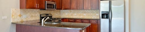 Kitchen with stainless steel appliances - 2 Bedroom