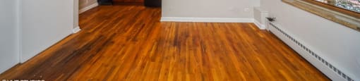Living room with hardwood flooring and a ceiling fan at 1355 Pearl in Denver, CO