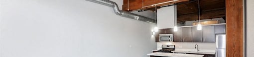 Open concept living space at Carriage House Lofts, Illinois, 60605