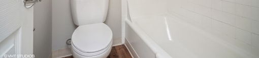 Toilet room with tiled shower at 878 S Dexter St in Denver, CO