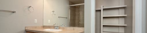 Bathroom with vanity storage and a huge closet