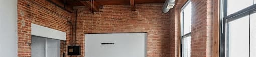 Spacious living area with stunning brick wallsriors- at Carriage House Lofts, Illinois, 60605