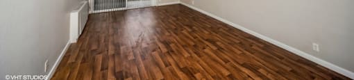 Open and airy living area with chic wood-like flooring at 878 S Dexter St in Denver, CO