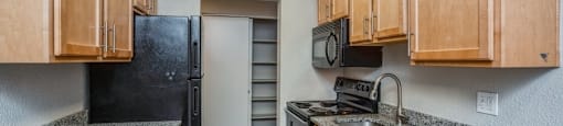 Spacious kitchen with granite counter tops