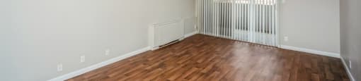 Spacious living room with private patio/balcony access at 878 S Dexter St in Denver, CO