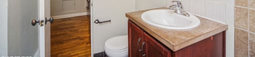 Bathroom with vanity storage and a mirror at 1355 Pearl in Denver, CO