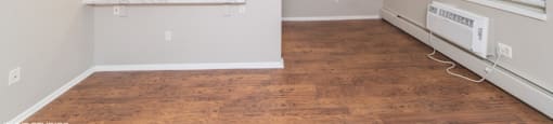 Open living area with beautiful wood flooring