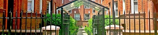 Stunning brick exterior with lovely courtyard