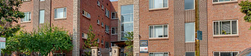 Come home to 1335 E Pearl, the exterior of the property is featured here with tall modern buildings at 1355 Pearl in Denver, CO