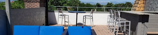 Beautifully upgraded rooftop patio with cornhole and grills