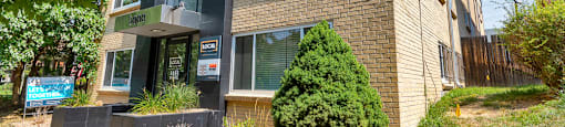 Well maintained landscaping and exterior buildings at 1444 Saint Paul St in Denver, CO
