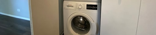 Conveniently located full size stackable washer and dryer