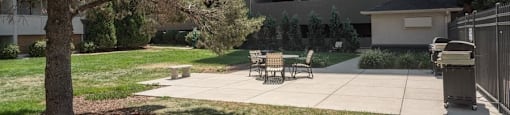 Exterior picnic tables and grills at 4600 E Kentucky Ave in Denver, CO