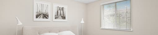 Relax in a light-filled bedroom with neutral tones, cozy textures, and a modern ceiling fan at 1303 Columbine in Denver, CO