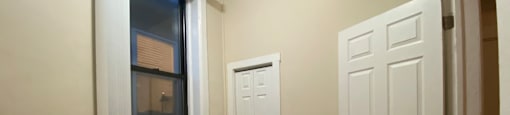 Bedroom with hardwood floors and a closet