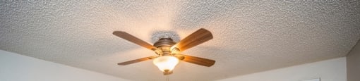 Bedroom with a ceiling fan and a large closet at 23–33 Pearl St in Denver, CO