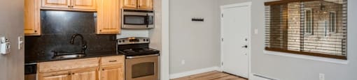 Open living area with rich wood flooring at 23–33 Pearl St in Denver, CO