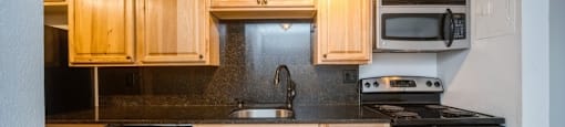 Granite countertops and backsplash in the kitchen at 23–33 Pearl St in Denver, CO
