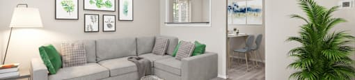A living room with a grey couch, a glass coffee table, and a plant at 1303 Columbine in Denver, CO