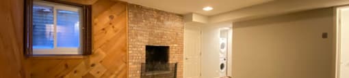 Main bedroom with fireplace and conveniently located laundry