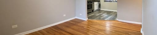 Living room with hardwood flooring and a ceiling fan