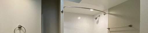 Bathroom with a full tub with tiled surround