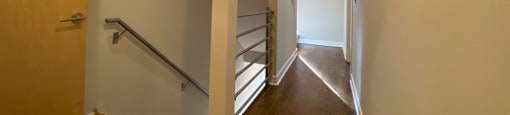 2nd floor hallway with staircase to lower floor