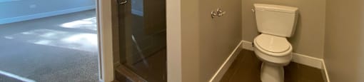 Shower with glass door in bathroom off the bedroom