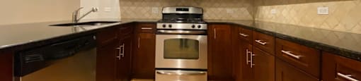 Rich wood cabinetry and granite countertops - 3 Bedroom
