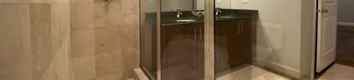 Shower with glass enclosure and tiled walls - 3 Bedroom