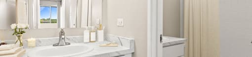A bathroom with a white sink and a toilet  at 4805 E Kentucky in Denver, CO