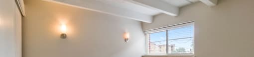 Bright and large bedroom with designer lighting