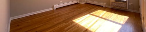 Sunny bedroom with hardwood floors - One Bedroom