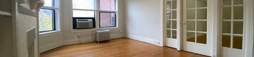 Bright room with lots of windows and crown molding