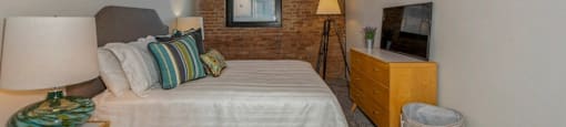 Bedroom with plush carpeting at Carriage House Lofts, Chicago, Illinois