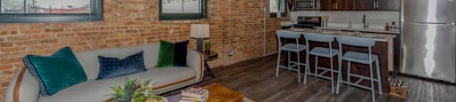 Exposed brick walls and ceiling beamsat Carriage House Lofts, Chicago, Illinois