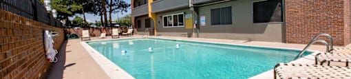 A pool in a courtyard surrounded by buildings at 878 S Dexter St in Denver, CO