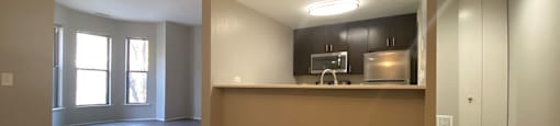 Kitchen with built in microwave and a pantry