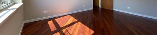 Large bedroom with hardwood floors