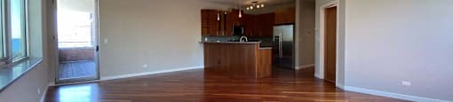 Spacious living area with hardwood floors