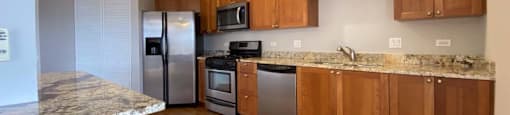 Spacious kitchen with hardwood floors and plenty of counterspace
