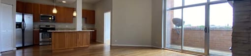 Breathtaking living space with hardwood floors and floor to ceiling windows