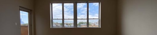 Large window and an attached balcony
