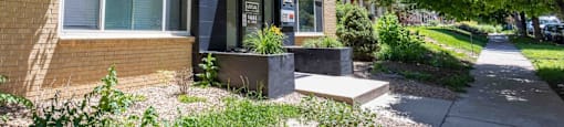 A stylish mid-century building tucked along a quiet, tree-lined street—where fresh updates meet neighborhood charm at 1444 Saint Paul St in Denver, CO