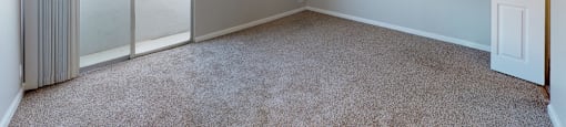 Large bedroom with balcony access at 878 S Dexter St in Denver, CO