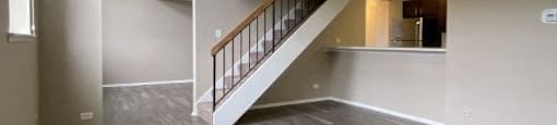 Stunning living space with an exposed staircase