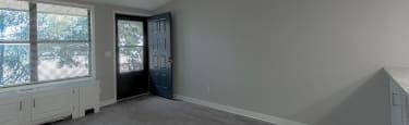A room with a window and a door.