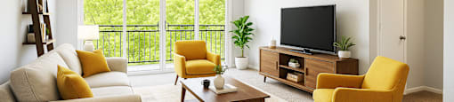A living room with a white couch, yellow armchair, and a coffee table.